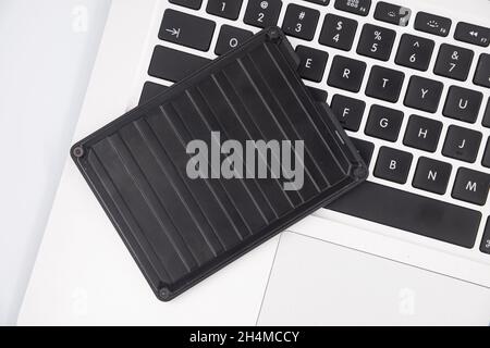 An external USB hard disk drive isolated on a white background. External Hdd drives and flash drives. External hard disk drive for connect to laptop, Stock Photo