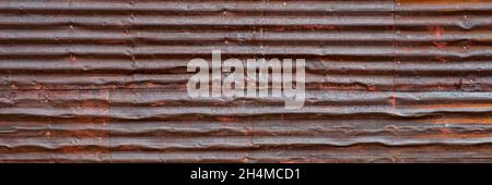 old, grunge, rusty, corrugated metal texture background - wall of weathered shack, panoramic banner Stock Photo