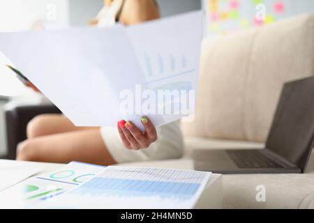 Lady analyze monthly report Stock Photo
