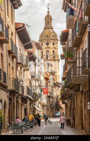 View of the main street in the Spanish village of Puente La Reina towards the church of Iglesia del Crucifijo  on the route of the Camino de Santiago Stock Photo