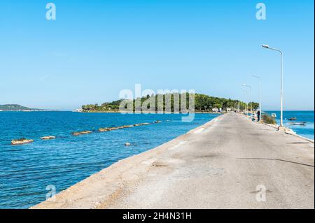 Urla, Izmir, Turkey – October 3, 2020. Artificial bridge connecting Karantina Island to mainland in Urla town of Izmir province in Turkey. During the Stock Photo
