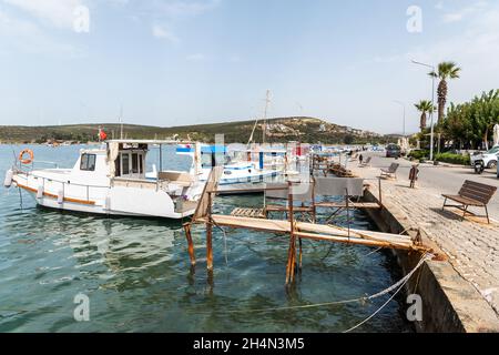 Sigacik, Izmir, Turkey – October 5, 2020. Waterfront in Sigacik neighborhood of Seferihisar district of Izmir Province in Turkey. View with fishing bo Stock Photo