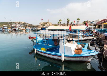 Sigacik, Izmir, Turkey – October 5, 2020. Waterfront in Sigacik neighborhood of Seferihisar district of Izmir Province in Turkey. View with fishing bo Stock Photo