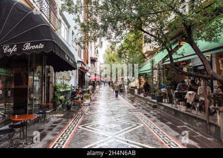 Istanbul, Turkey – November 15, 2020. Ali Suavi Sokak street in Kadikoy neighborhood of Istanbul. View with commercial properties and people, on a clo Stock Photo