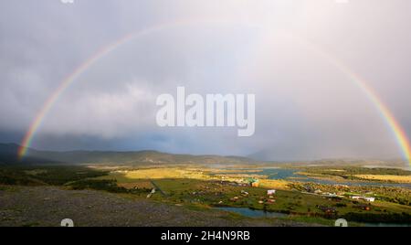 A rainbow over El Chaltén, small town outside of Torres del Paine National Park. Stock Photo