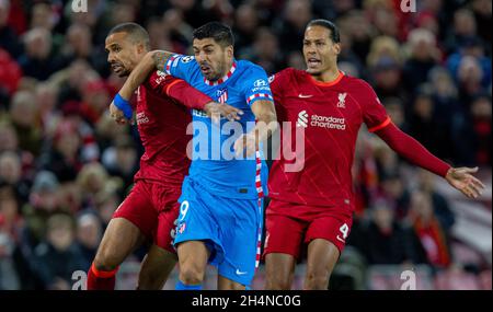 Liverpool. 3rd Nov, 2021. Atletico Madrid's Luis Suarez (C) is challenged by Liverpool's Joel Matip (L) and Virgil van Dijk during the UEFA Champions League Group B match between Liverpool and Atletico Madrid in Liverpool, Britain, on Nov. 3, 2021. Liverpool won 2-0. Credit: Xinhua/Alamy Live News Stock Photo