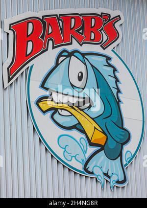 Fish and chips restaurant sign on the wall in street photo. Barb's restaurant famous place for fish and chips in Victoria BC, Canada. July 23,2021. St Stock Photo