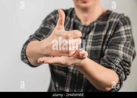 Deaf woman show her hand for Help or aid as sign language. Deaf body language concept . High quality photo Stock Photo