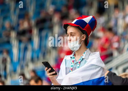 Saint Petersburg, Russia – June 16, 2021. Russian fan girl at EURO 2020 match Finland vs Russia (0-1). Stock Photo