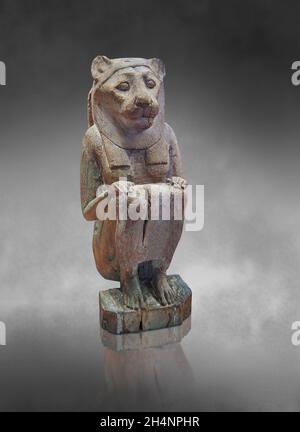 ptolemaic Egyptian statue sculpture of a Lion Goddess, probably Sekhmet , 664-332 BC, squatting. Louvre Museum inv N2509. Stock Photo