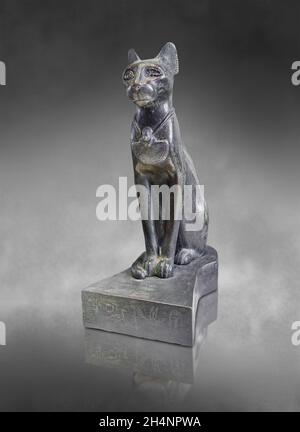 Egyptian statue sculpture of the goddess Bastet as a cat, 664-610 BC, 26th dynasty, bronze.. Louvre Museum E2533. Reign of Psammetique 1st. Inscriptio Stock Photo