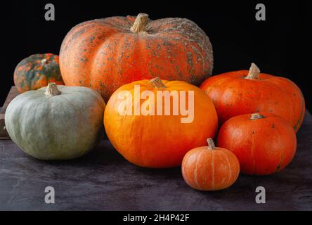 Autumn pumpkins on grey table Stock Photo