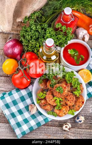 Meatballs of fresh meat with herbs, tomato sauce and vegetables Stock Photo