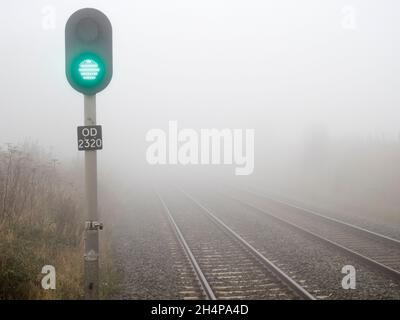 On a foggy Autumn day like this, even the mundane can be transformed by beauty. Radley Railway Station is shrouded in mist and mystery, whilst spectra Stock Photo - Alamy