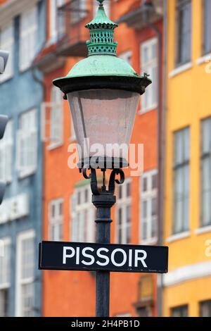 Nyhavn is a clebrated17th-century waterfront, canal and entertainment district in Copenhagen, Denmark.Lined by brightly coloured 17th and early 18th c Stock Photo