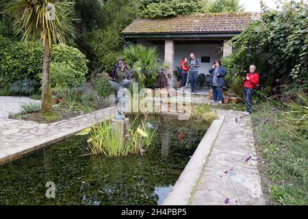 Cornwall tourists; visitors in The Italian Garden section of The Lost Gardens of Heligan, Cornwall UK Stock Photo