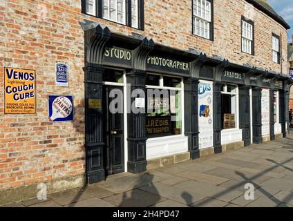 Shop buildings in the wonderful 1900's town at Beamish Museum - chemists shop with photography studio. Stock Photo
