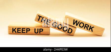 Keep up the good work, text is written on wooden blocks Stock Photo