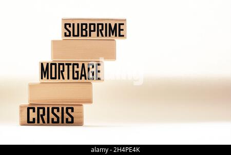 SUBPRIME MORTGAGE CRISIS - words on wooden blocks. Business concept Stock Photo