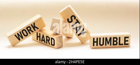 Work Hard, Stay Humble Text written on wooden blocks and white background. Image motivational concept Stock Photo