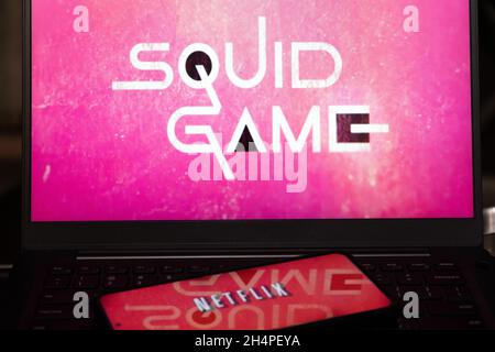 Laptop screen showing the very popular korean drama series squid game on netflix which has become a best seller, cryptocurrency and is renewed for a Stock Photo