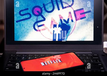 Laptop screen showing the very popular korean drama series squid game on netflix which has become a best seller, cryptocurrency and is renewed for a Stock Photo