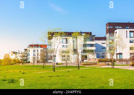 Residential area in city. European complex of modern apartment buildings. Outdoor facilities. Eco-friendly living in city. Scandinavian architecture Stock Photo