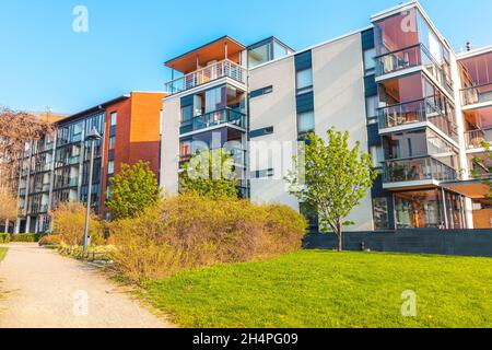 European residential complex of apartment buildings. Outdoor facilities. Eco-friendly living in a city Modern block of flats Scandinavian architecture Stock Photo