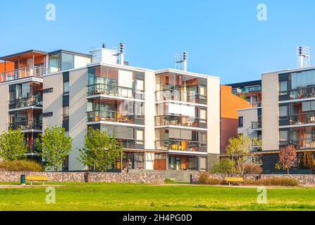 European residential complex of apartment buildings. Outdoor facilities. New modern block of flats with cozy courtyard and green area. Eco-friendly Stock Photo