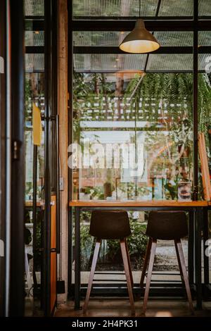 Tables and chairs in a cafe. Interior of old coffee shop with brown decoration Stock Photo
