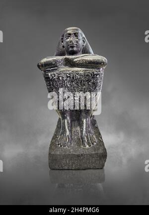 Egyptian cube statue of the attendant Akhimenrou, 664-610 BC, 26th dynaty, Thebes,  diorite. Louvre Museum A 85, MR10 or N86. The statue is dedicated Stock Photo