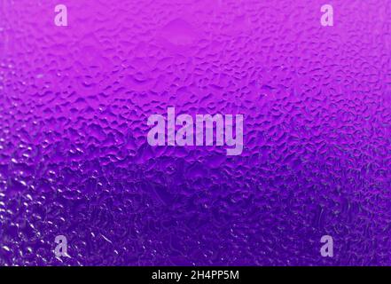 Closeup Texture of Water Droplets of a Chilled Purple Glass Condensation Stock Photo