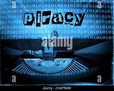Typewriter displaying Piracy in a blue tone Stock Photo