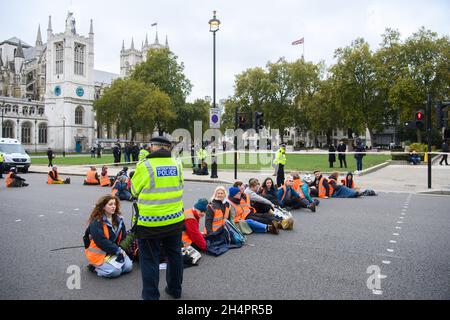 London, UK. 4 November 2021. Insulate Britain protesters block roads around Parliament Square in central London. Picture date: Thursday November 4, 2021. Photo credit should read: Matt Crossick/Empics/Alamy Live News Stock Photo