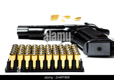 Cartridges and bullets for traumatic weapons. A lot of cartridges for a traumatic gun on a white background at the bottom of the photo Stock Photo