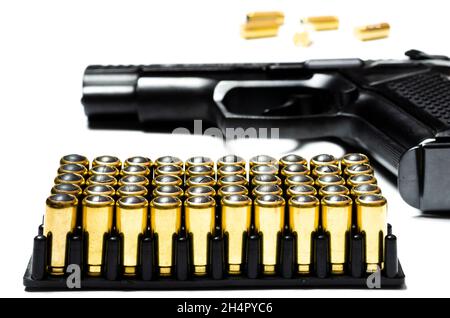 Cartridges and bullets for traumatic weapons. A lot of cartridges for a traumatic gun on a white background at the bottom of the photo Stock Photo