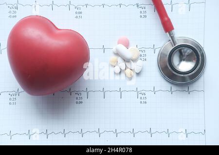 stethoscope and heart on a cardio diagram. Stock Photo