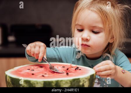 Kid eating watermelon.  Stock Photo