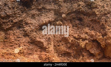 carving mountain earth soil, red color tone, oxidized and very fertile soil red clay background, texture, backdrop for photography Stock Photo