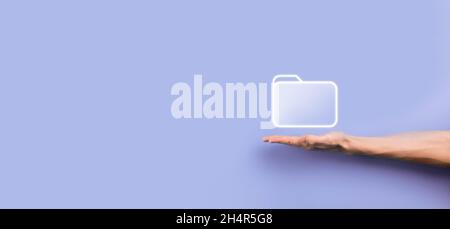 Businessman hold folder icon.Document Management System or DMS setup by IT consultant with modern computer are searching managing information and corp Stock Photo
