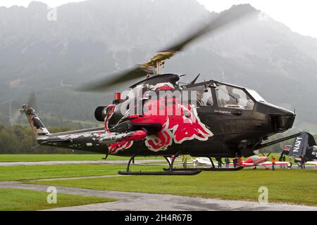 NIEDEROEBLARN, AUSTRIA - Sep 18, 2014: Flying Bulls Bell Ah-1 Cobra helicopter taking off in Niederoeblarn Stock Photo