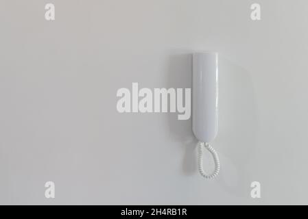 White intercom to open the door in the apartment Stock Photo