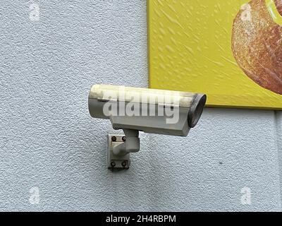 Security camera mounted on an exterior wall in Georgia Stock Photo