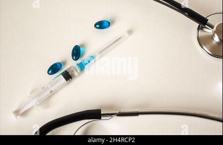 Stethoscope of various pills and injections on a white background. Medicine concept. Stock Photo