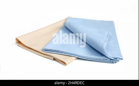 Two folded textile napkins isolated on white background. Stock Photo
