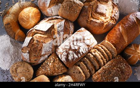 Assorted bakery products including loafs of bread and rolls Stock Photo