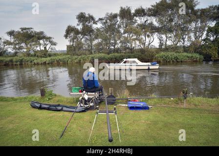 fishing on river thurne at martham norfolk england Stock Photo