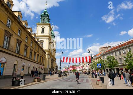 Warsaw, Poland - May 03, 2015: Krakowskie Przedmiescie Str. and Holy Cross Church designed by the architect Joseph Simon Bellotti,  built between 1679 Stock Photo