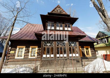 Zakopane, Poland - March 10, 2015: Residential house, wooden villa built in  approx. 1897 in the style of the regional architecture, listed in the mun Stock Photo