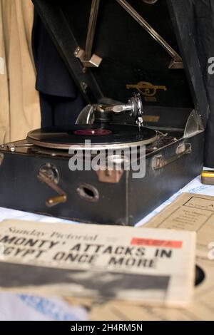 Record playing on wind-up gramophone player in wartime Britain